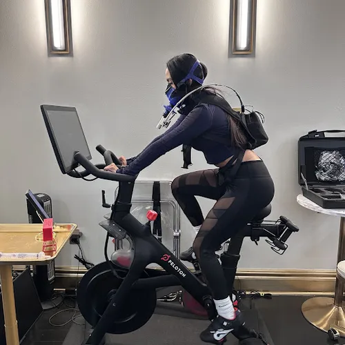 A patient completing PNOE metabolic testing on a stationary bike at InCare Tampa